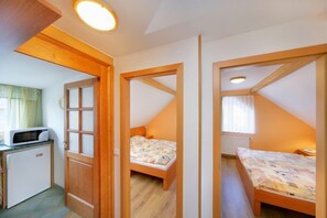 Departamento familiar, 2 habitaciones | Cocineta privada | Refrigerador y tetera eléctrica 
