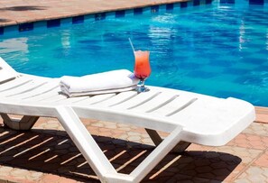 Outdoor pool, pool umbrellas, pool loungers