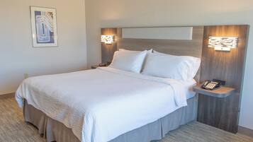 Desk, laptop workspace, blackout drapes, cribs/infant beds