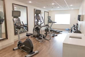 A fitness center with treadmills, elliptical machines, and a weight bench. - Holiday Inn Express & Suites Temple - Medical Center Area by IHG (Temple)