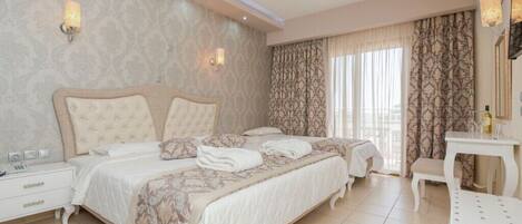A hotel room with a large bed, a bedside table, a chair, and a mirror.