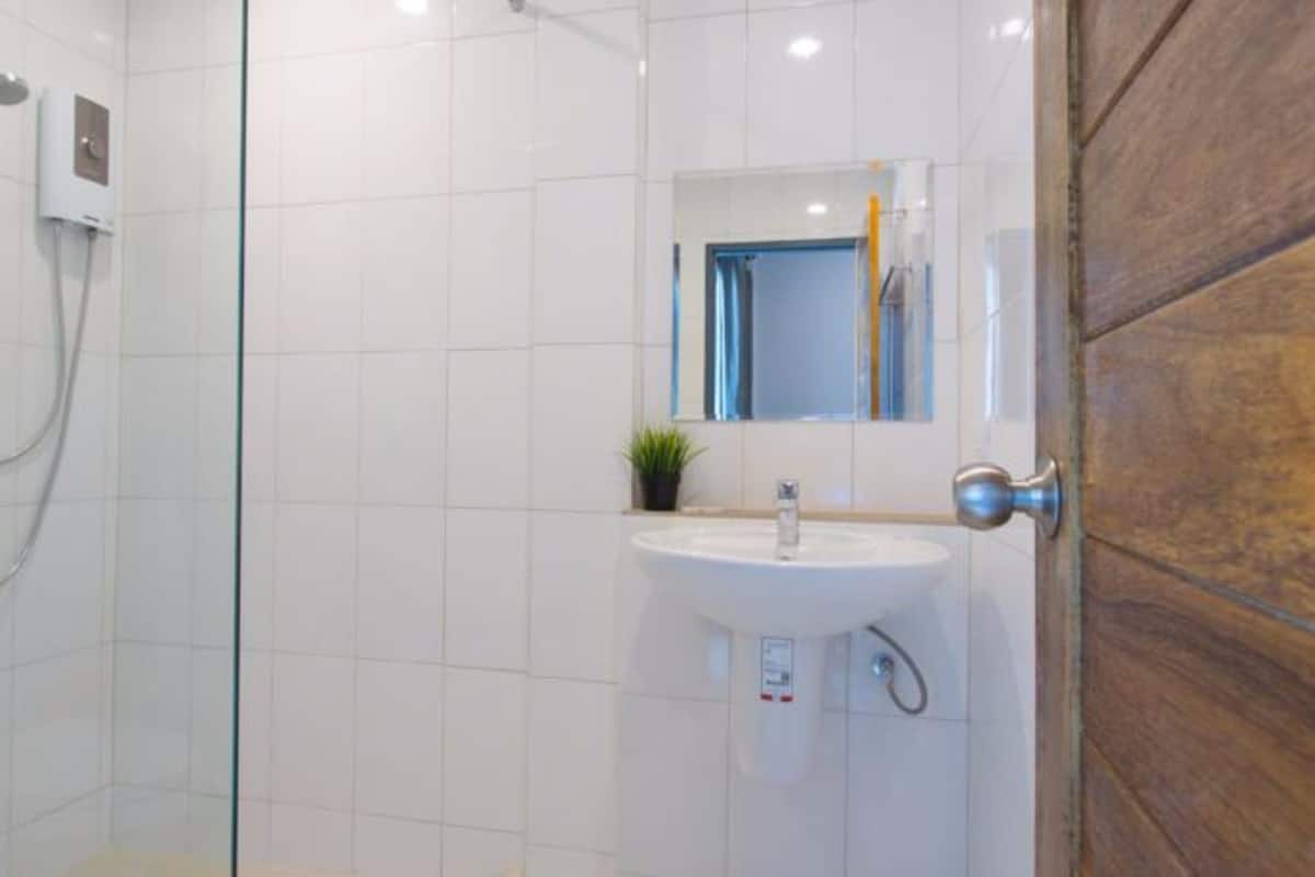 standard triple bed room | bathroom sink