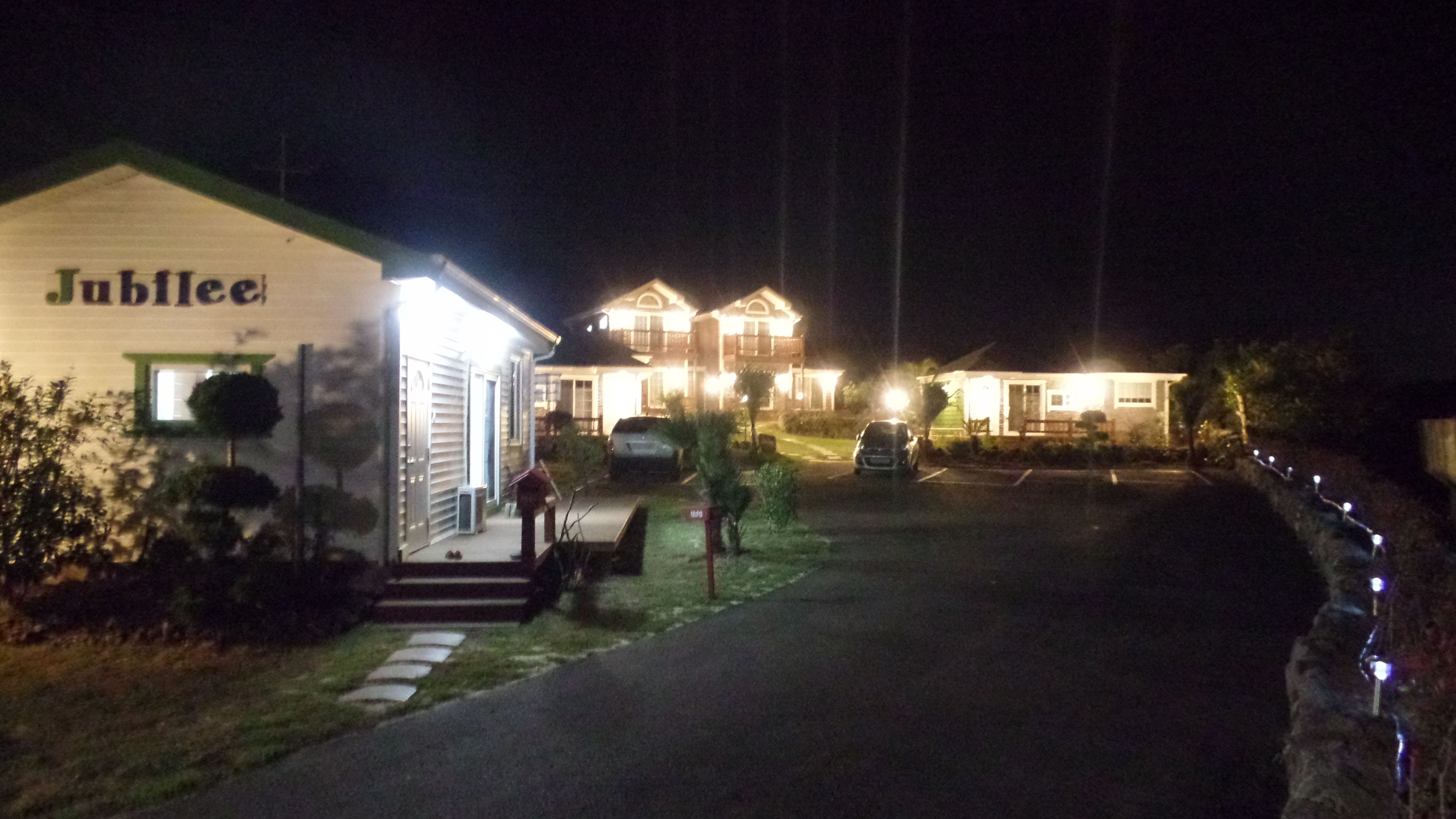A row of houses with a sign reading "Jubilee" on the left.