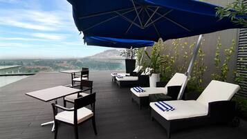 Outdoor pool, pool umbrellas, pool loungers