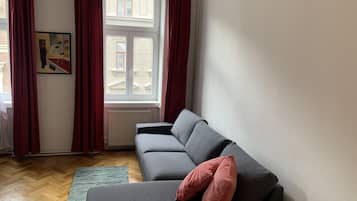 Basic Apartment, 1 Bedroom | Living area | Flat-screen TV, DVD player