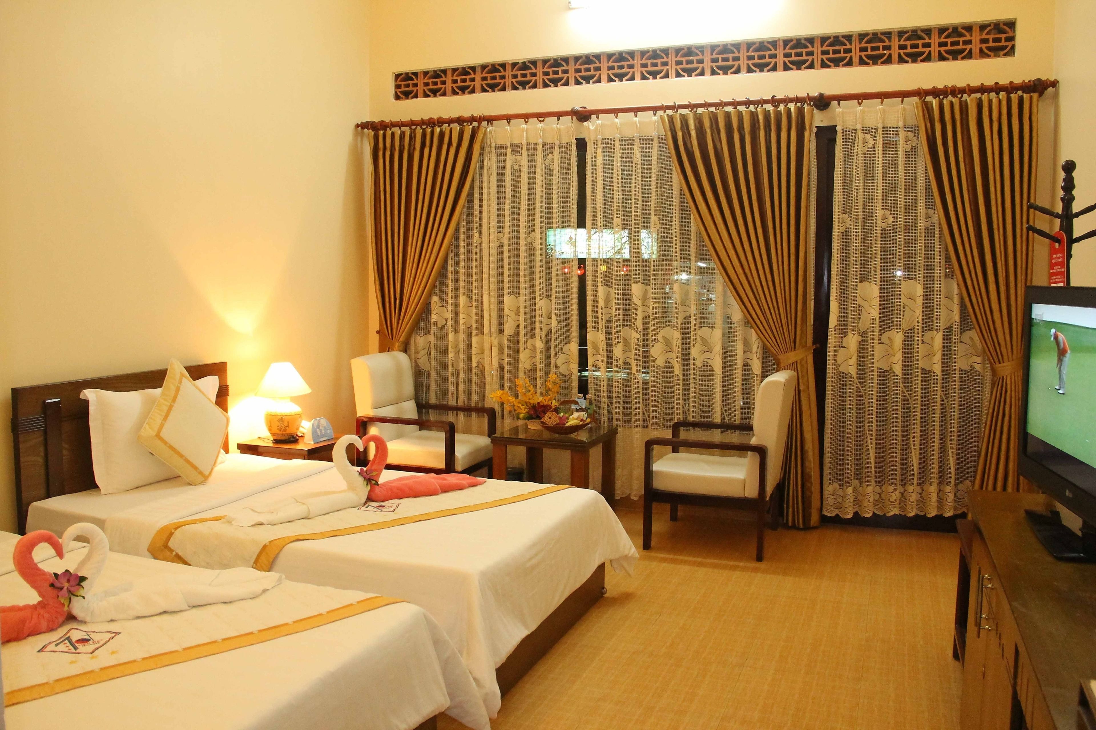 deluxe room, road view (seaside) | premium bedding, minibar, in-room safe, desk