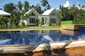 Outdoor pool, pool umbrellas, sun loungers