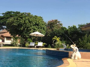 Outdoor pool, open 7 AM to 7:30 PM, pool umbrellas