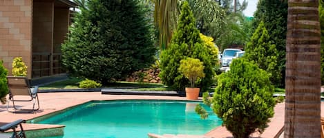 Outdoor pool, pool umbrellas, sun loungers