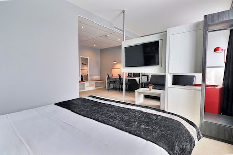 Superior Room, 1 King Bed with Sofa bed | Premium bedding, individually decorated, desk, laptop workspace. Hôtel des Lumières Lyon Meyzieu Arena Stadium