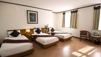 Deluxe Triple Room | Minibar, in-room safe, desk, free WiFi