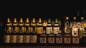 A collection of liquor bottles on a shelf.