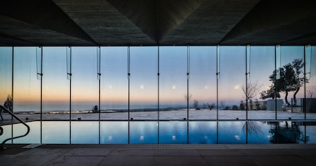Indoor pool, seasonal outdoor pool, pool umbrellas, sun loungers