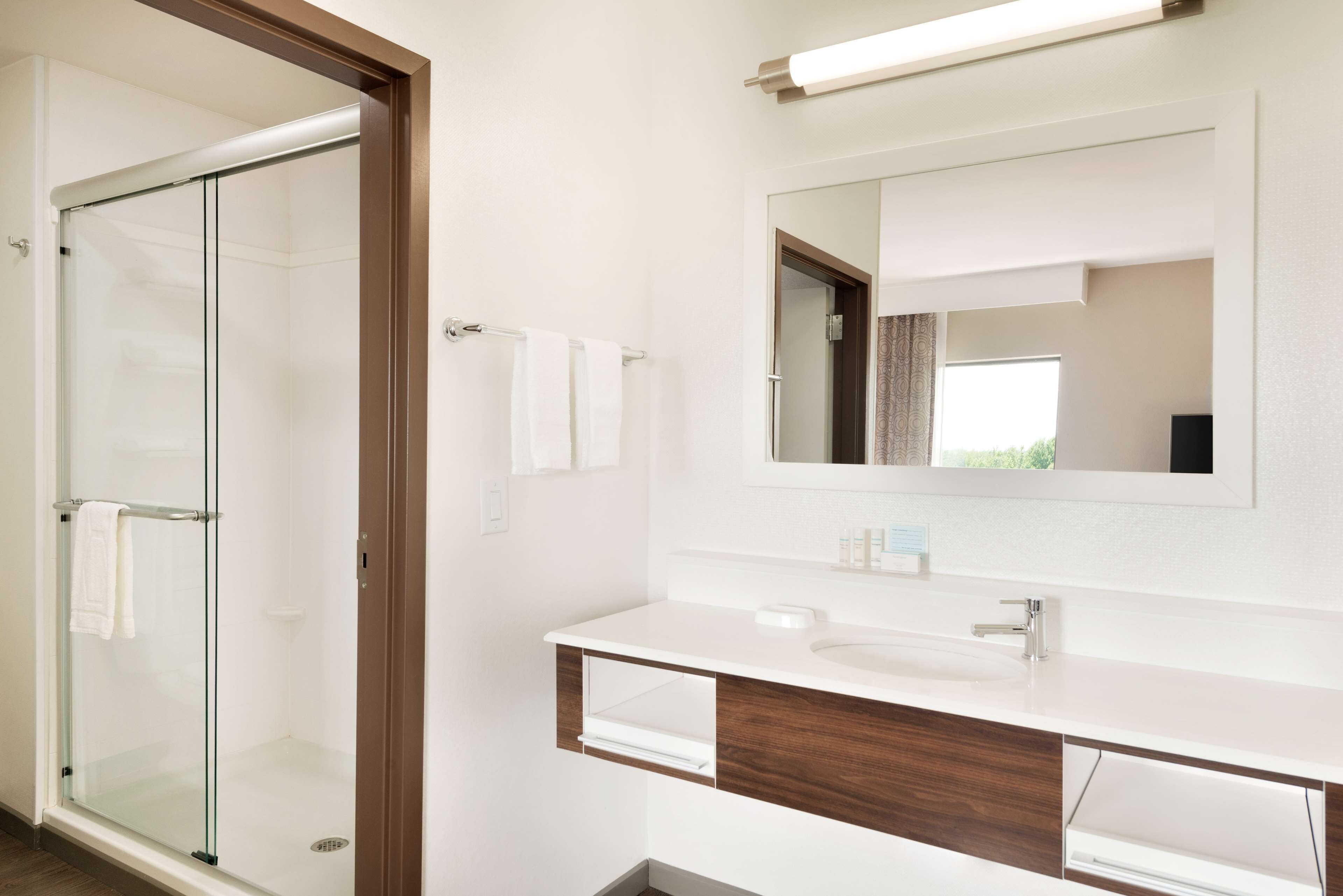 designer toiletries, hair dryer, towels