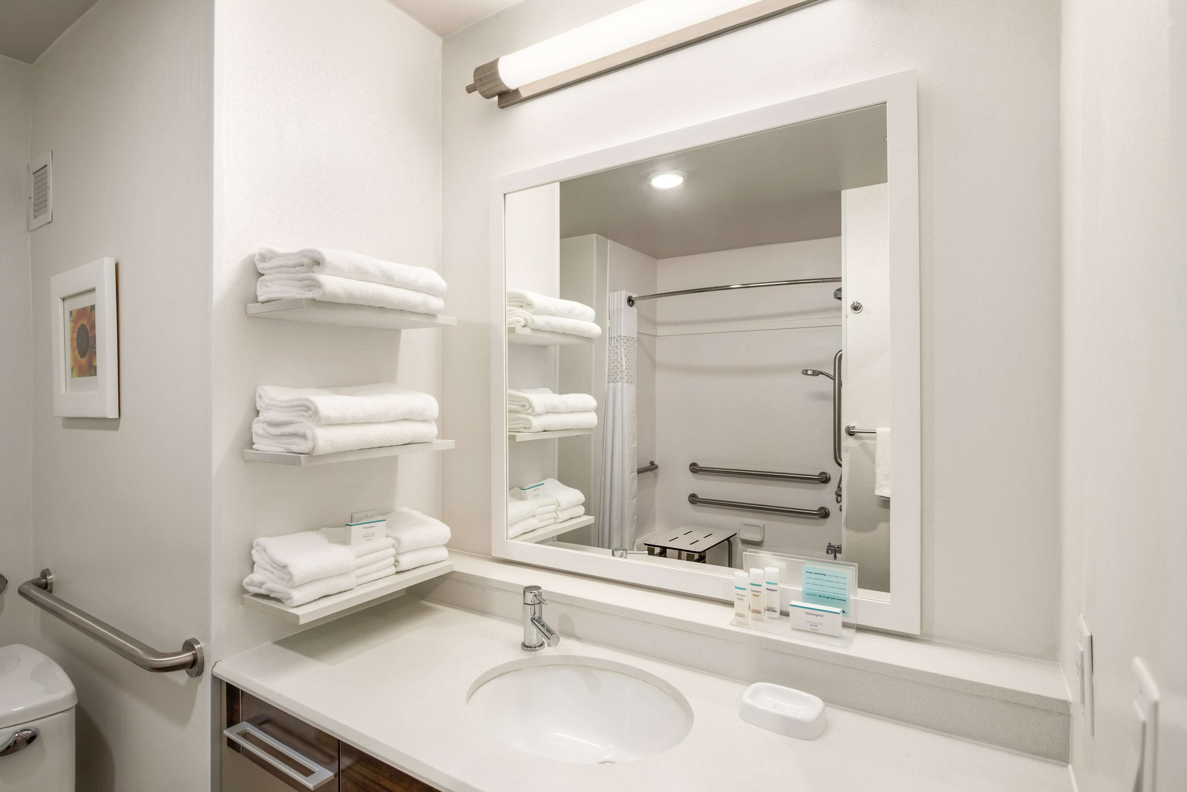 designer toiletries, hair dryer, towels