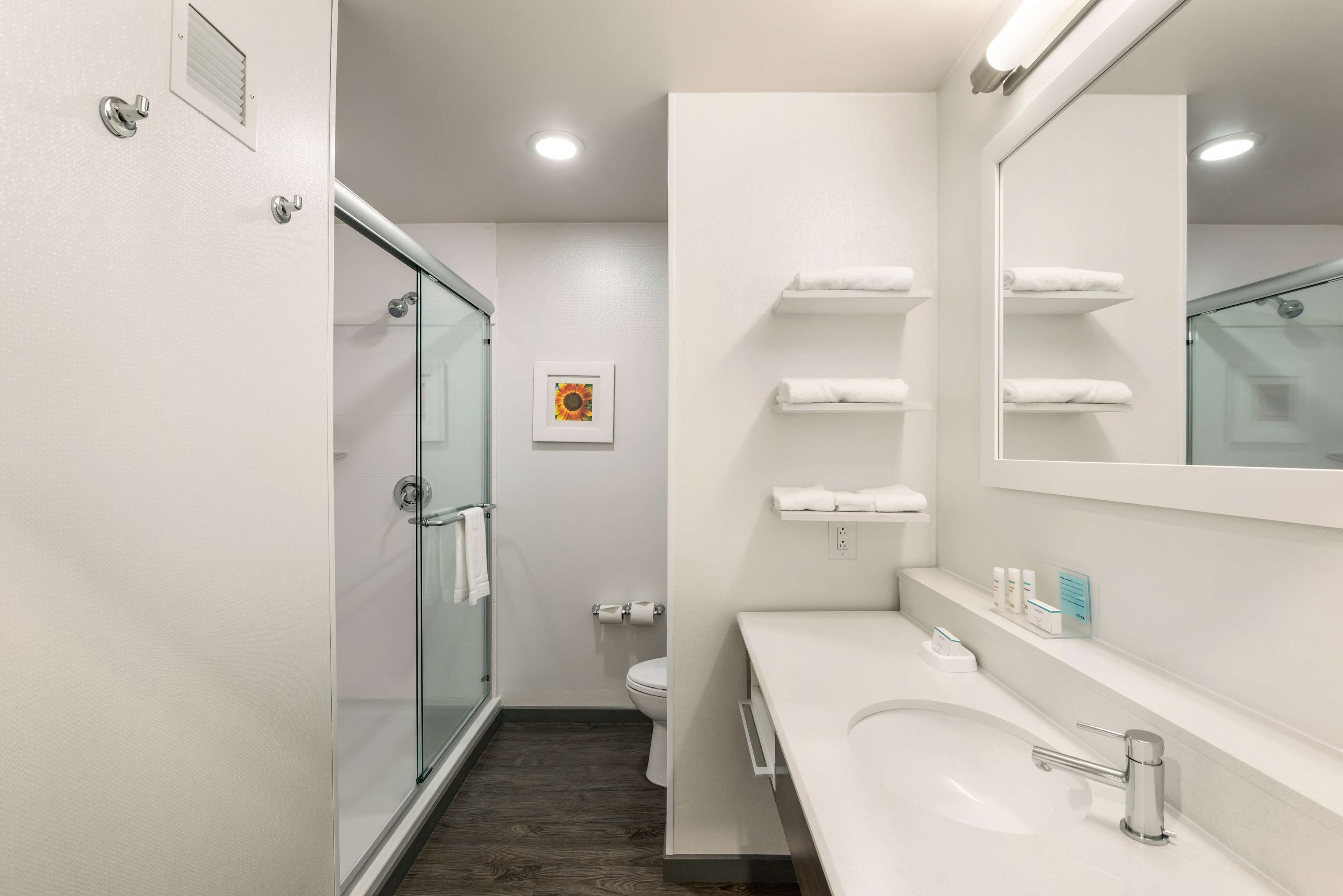 designer toiletries, hair dryer, towels