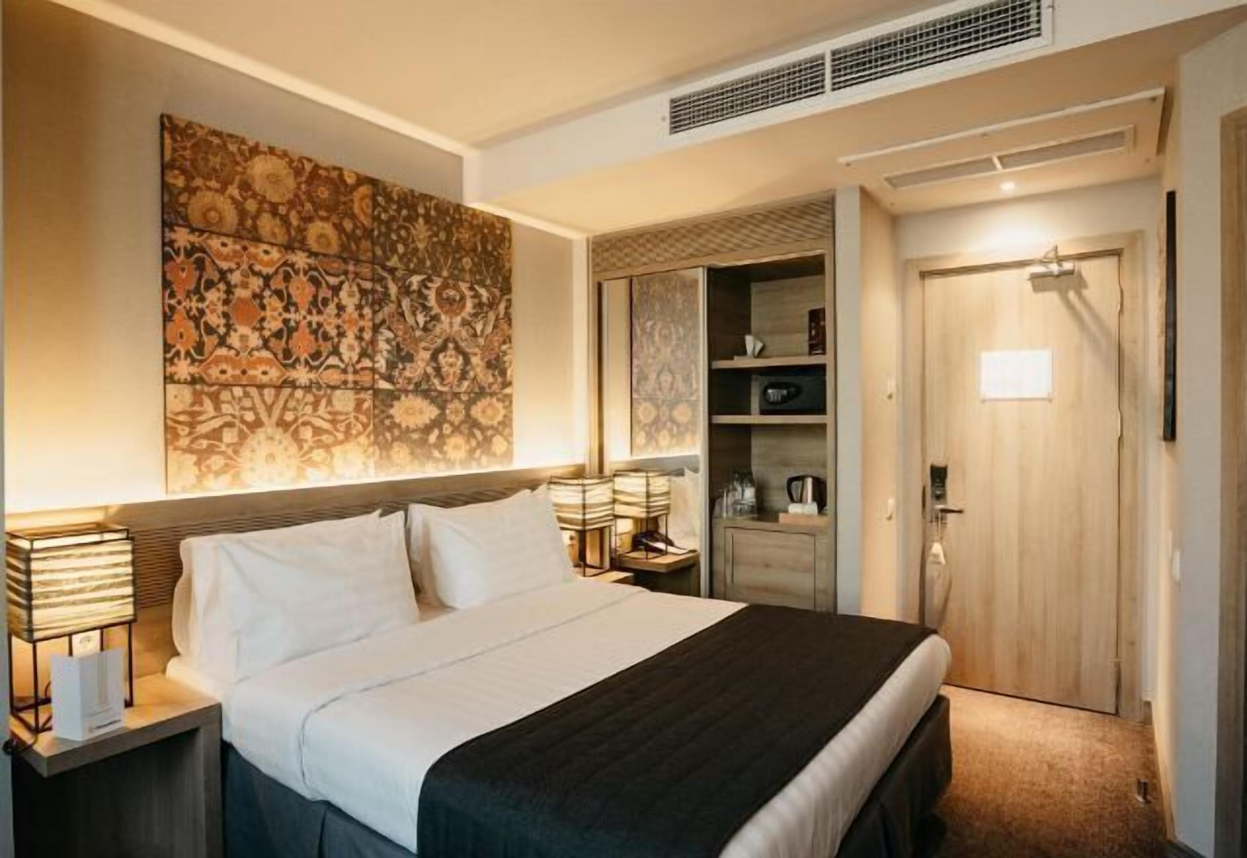 Minibar, caixa forta a l'habitació i cortines opaques 