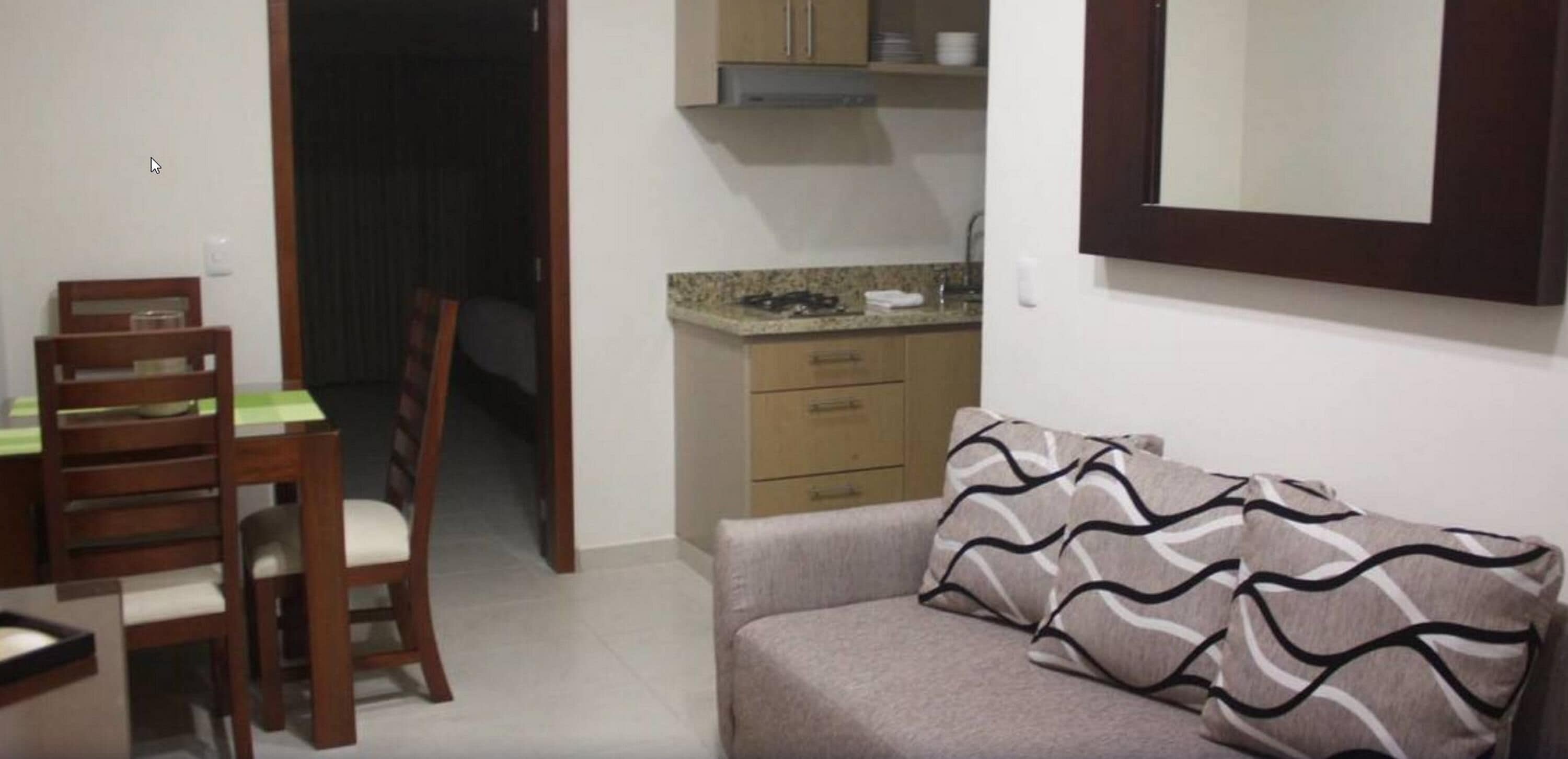 Junior Suite, 1 King Bed | Living room | 32-inch TV with cable channels