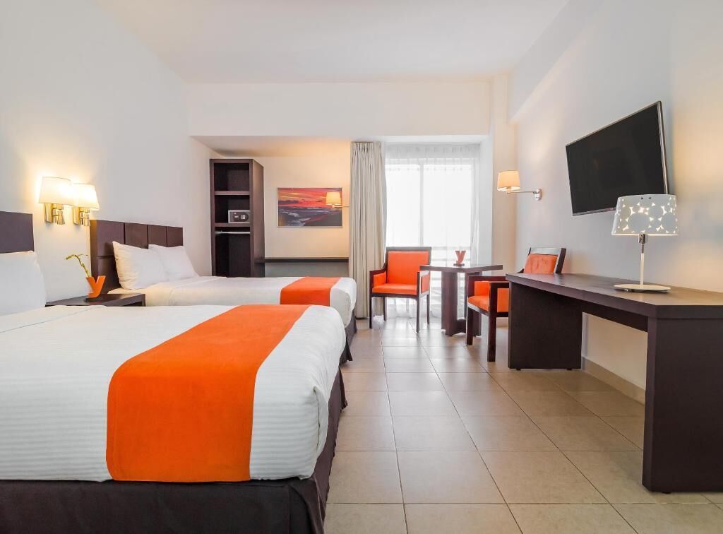 standard room, 2 double beds | in-room safe, desk, laptop workspace, iron/ironing board