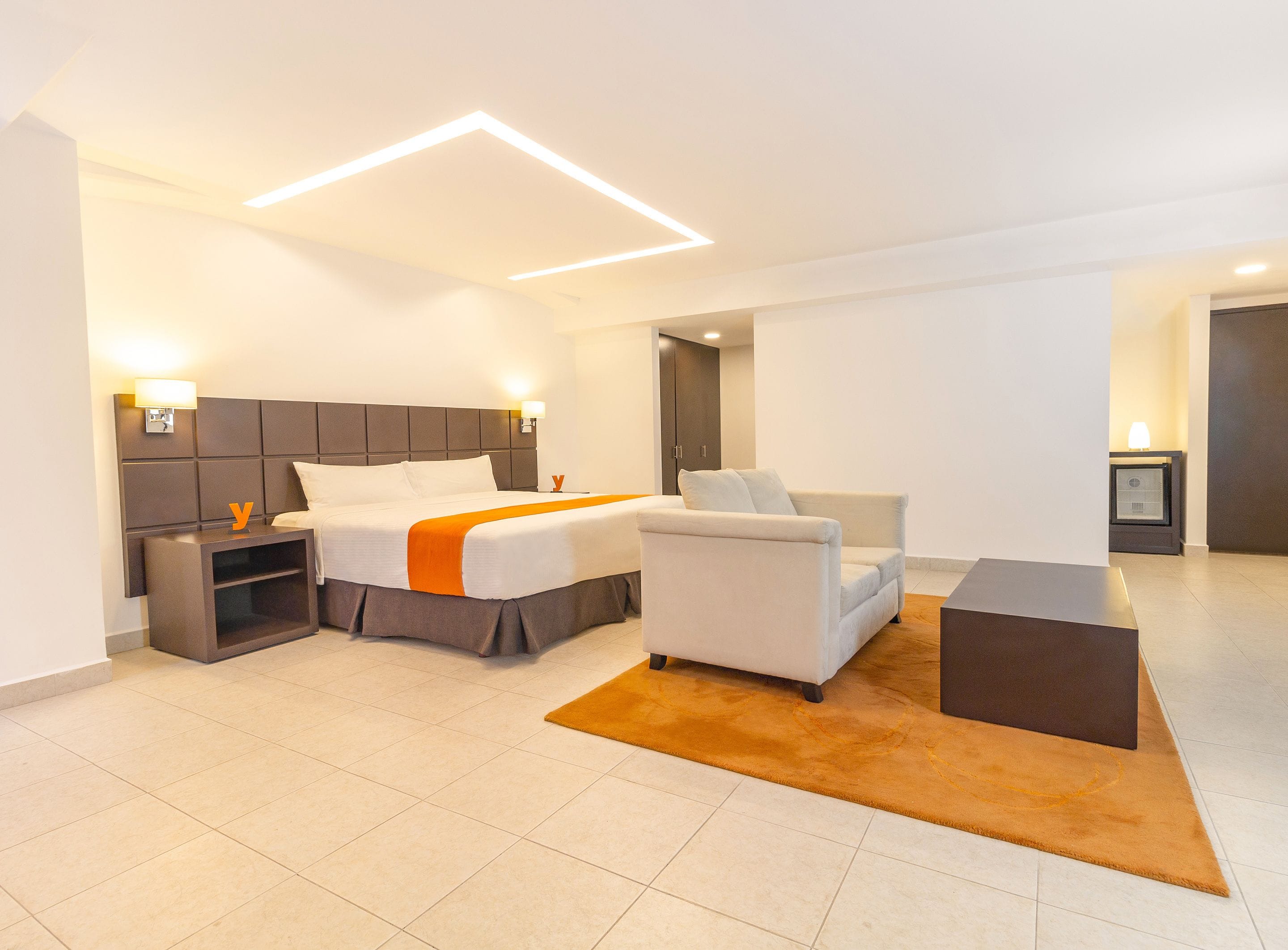 junior suite | in-room safe, desk, laptop workspace, iron/ironing board