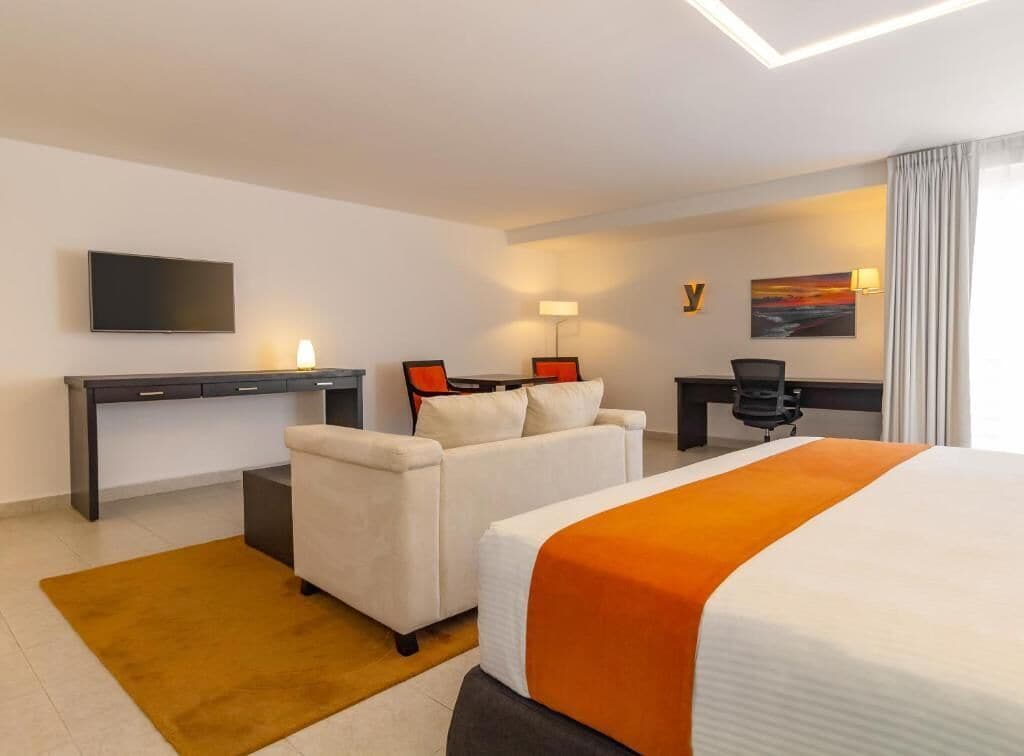 junior suite | in-room safe, desk, laptop workspace, iron/ironing board