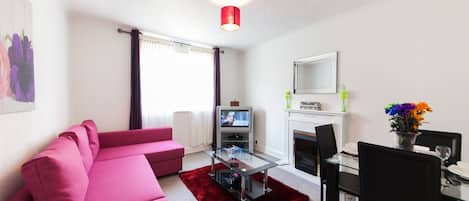 Apartment, 2 Bedrooms (First Floor) | Living room | Flat-screen TV, DVD player, iPod dock