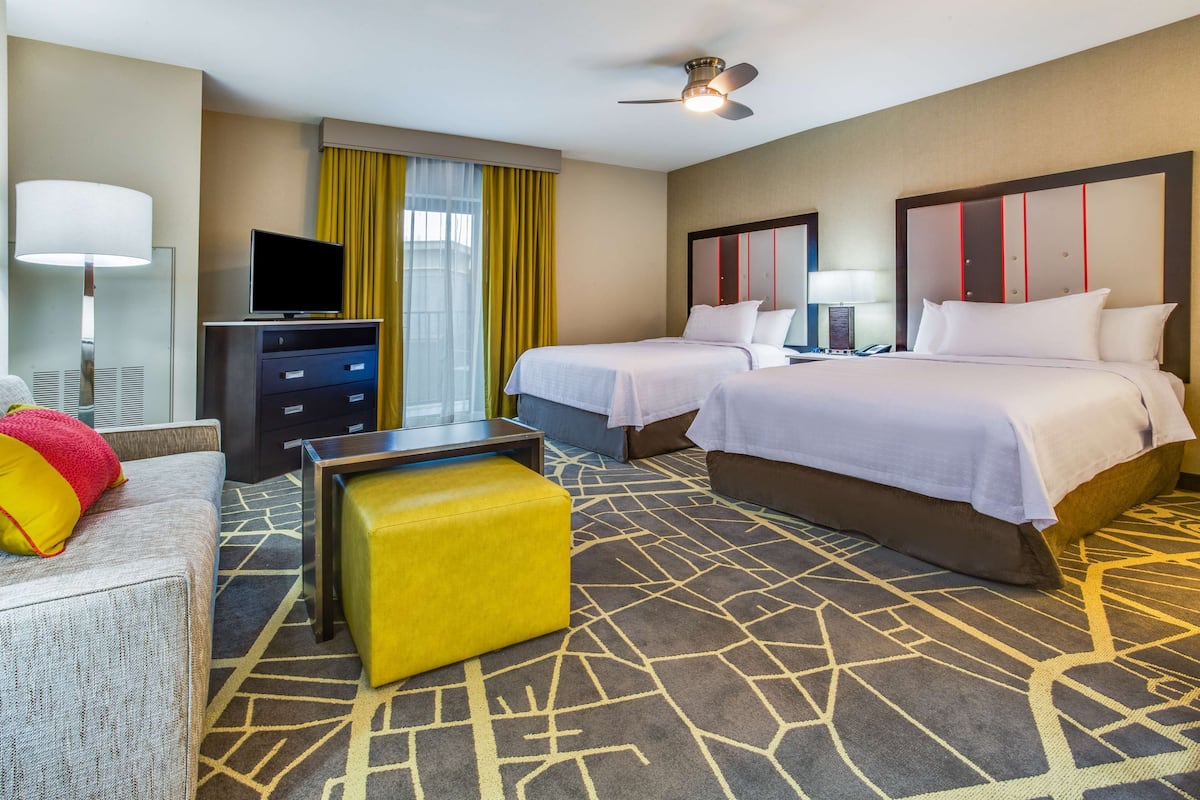 Premium bedding, desk, laptop workspace, blackout drapes