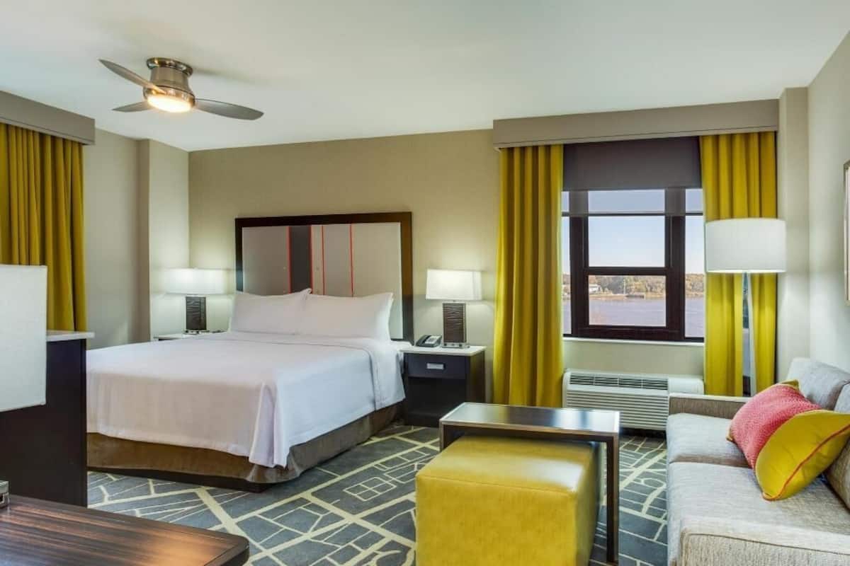 Premium bedding, desk, laptop workspace, blackout drapes
