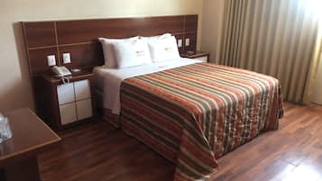 Habitación Confort | Ropa de cama de alta calidad y caja de seguridad en la habitación