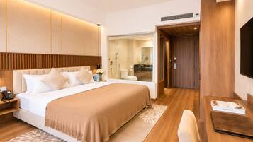 Deluxe Double Room, Balcony | Minibar, in-room safe, individually furnished, desk