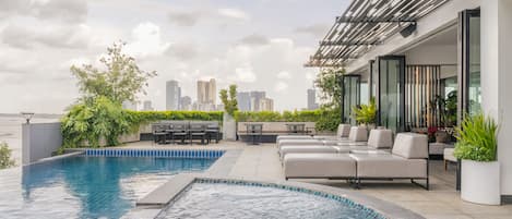 Outdoor pool, open 8:00 AM to 8:00 PM, sun loungers