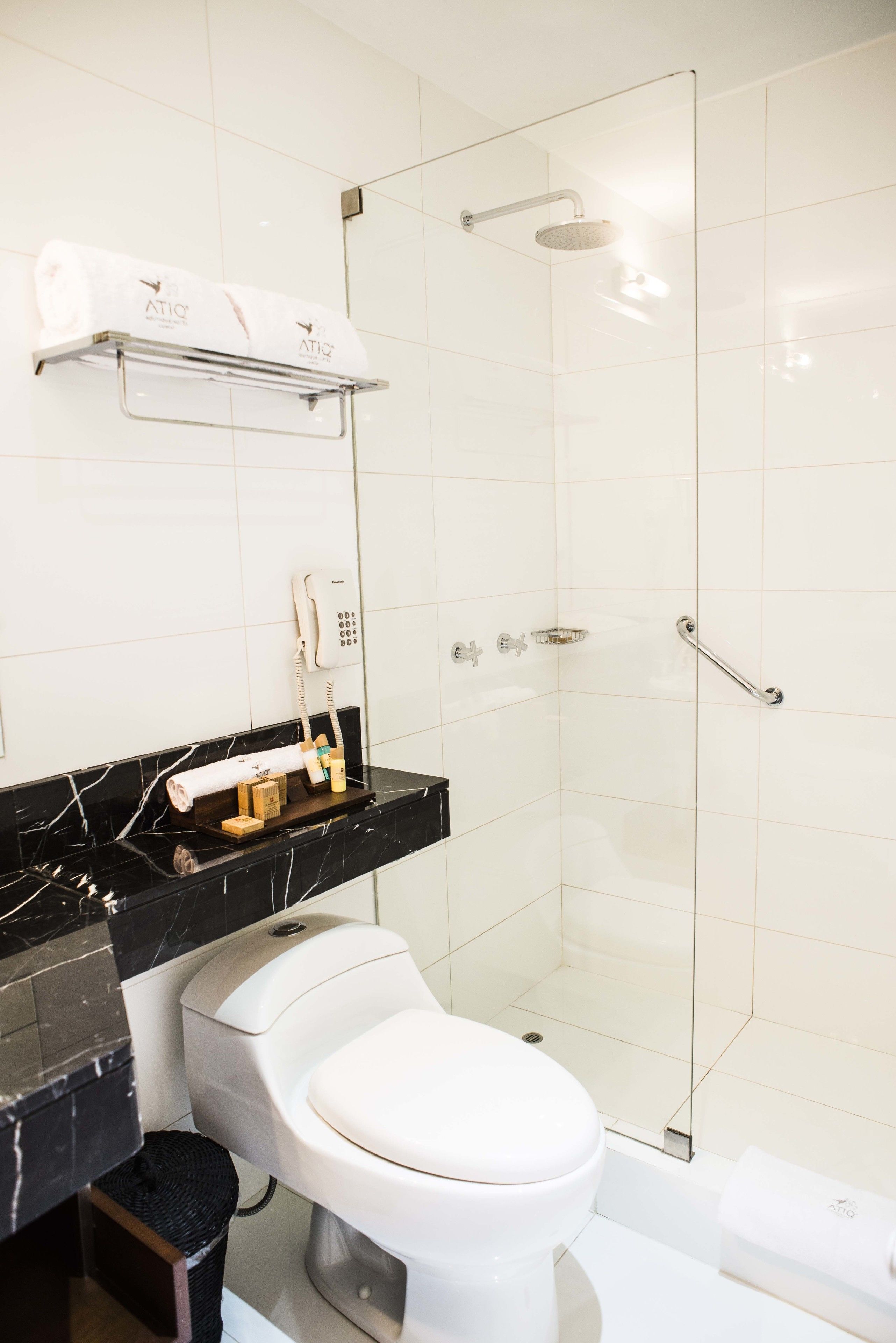 junior suite, 2 double beds | bathroom | rainfall showerhead, free toiletries, hair dryer, bathrobes