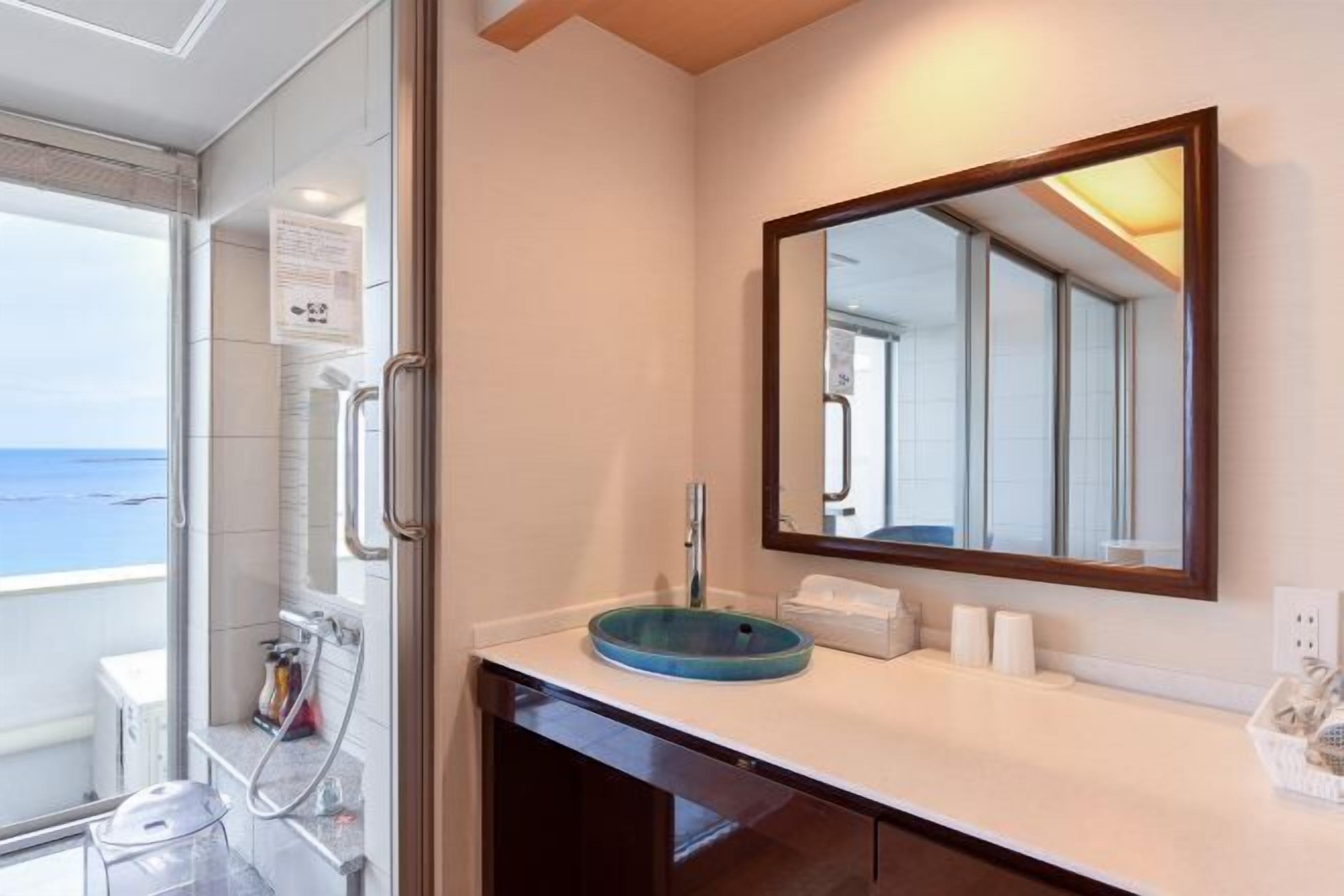 Bathroom | Hair dryer, slippers, electronic bidet, towels