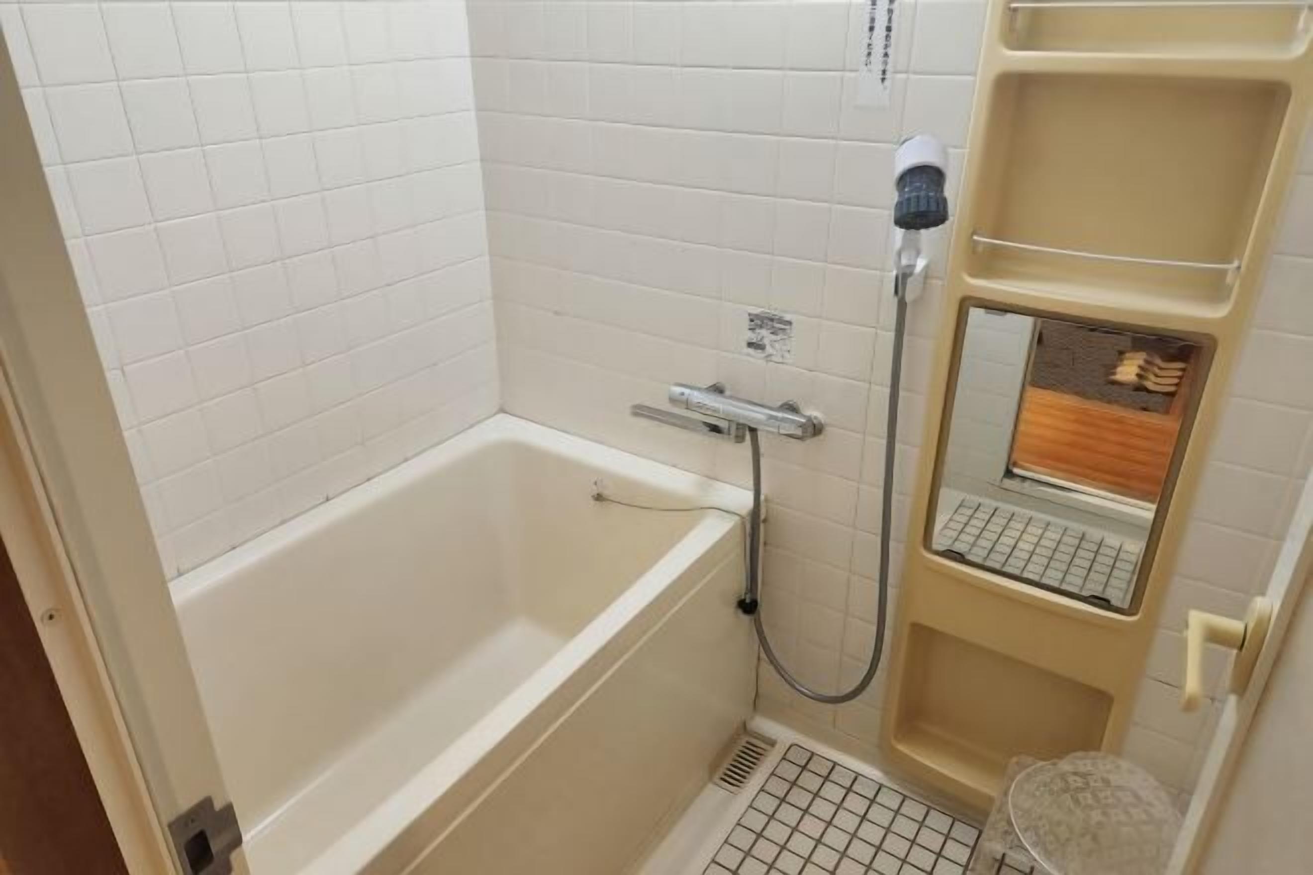 Bathroom | Hair dryer, slippers, electronic bidet, towels
