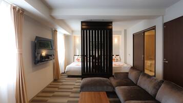 Deluxe Room | Desk, laptop workspace, blackout curtains, iron/ironing board