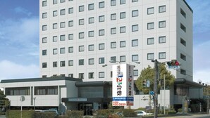 A modern hotel building with a prominent sign for Hotel 123 Kurashiki. - Hotel 1-2-3 Kurashiki (Kurashiki)