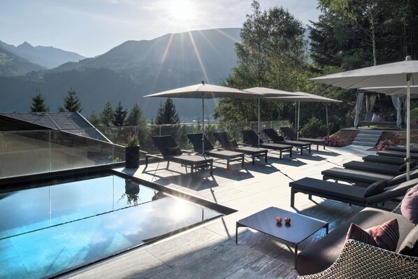 Indoor pool, outdoor pool, open 7:00 AM to 9:00 PM, pool umbrellas