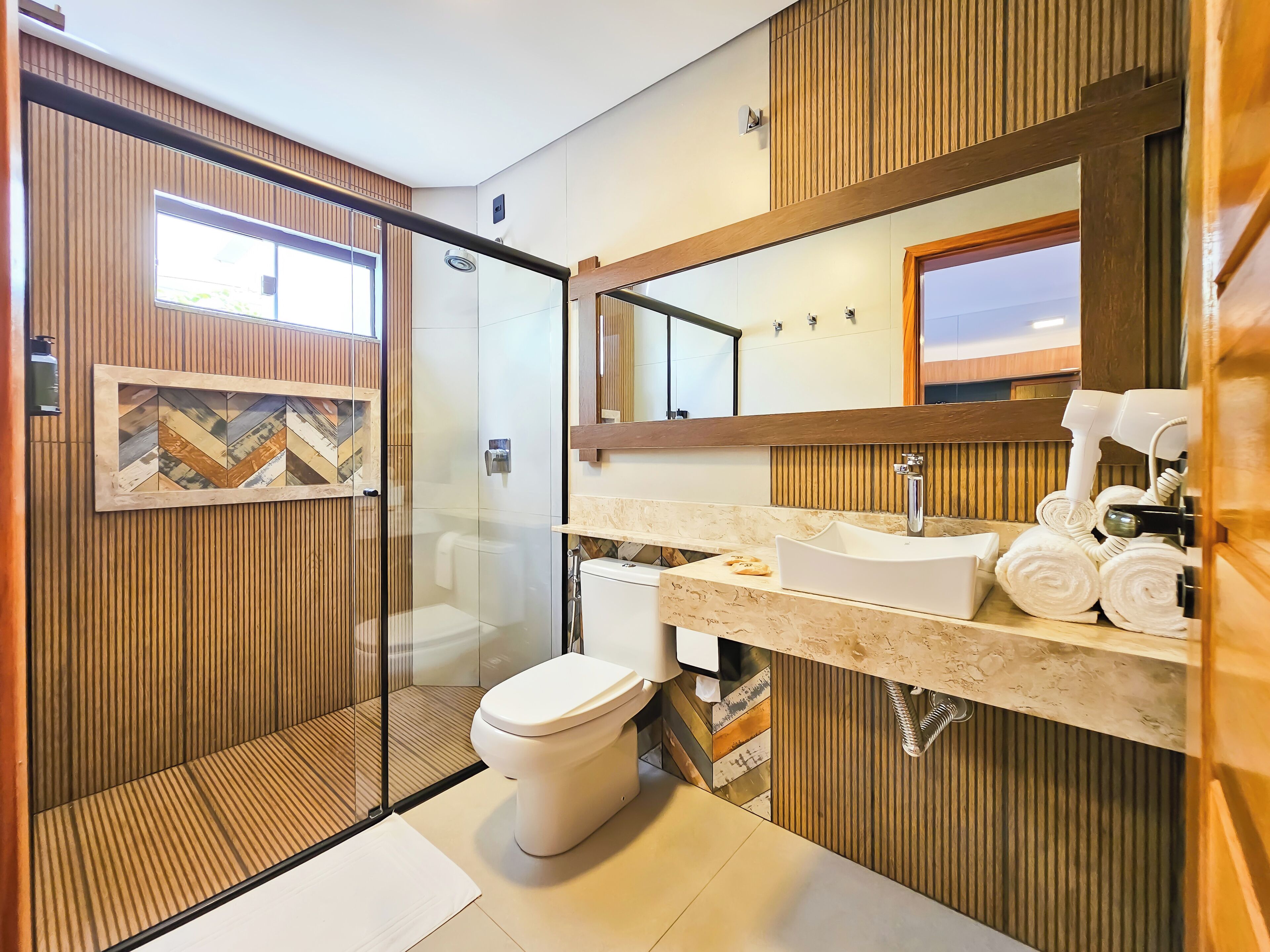 deluxe apartment, pool view | bathroom | shower, free toiletries, hair dryer, towels