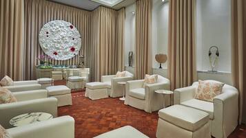 Relax in a stylish lounge area with sofas, armchairs, and a decorative centerpiece.