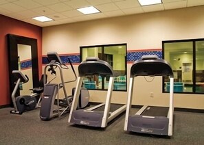 A gym with treadmills, stationary bikes, and elliptical machines. - Hampton by Hilton Bar Harbor (Bar Harbor)