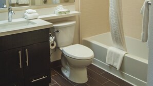 A bathroom with a sink, toilet, and bathtub. - Candlewood Suites Fort Collins by IHG (Fort Collins)