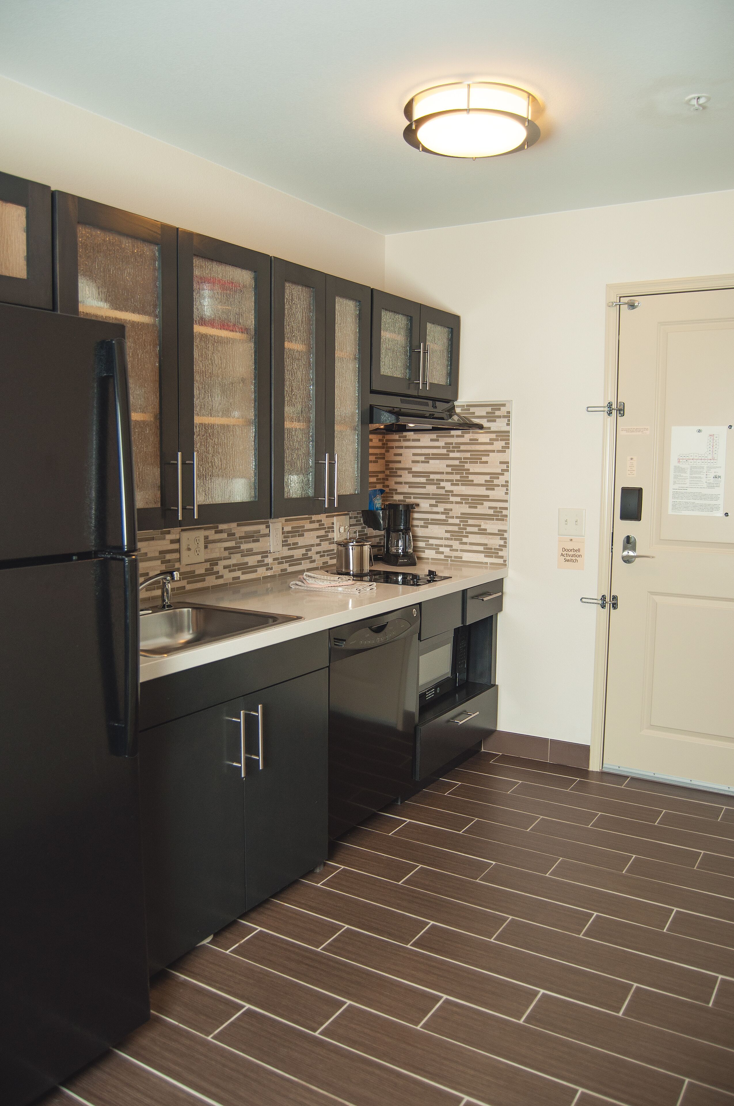 studio suite, 1 king bed, accessible (comm, tub) | private kitchen | full-sized fridge, microwave, stovetop, dishwasher