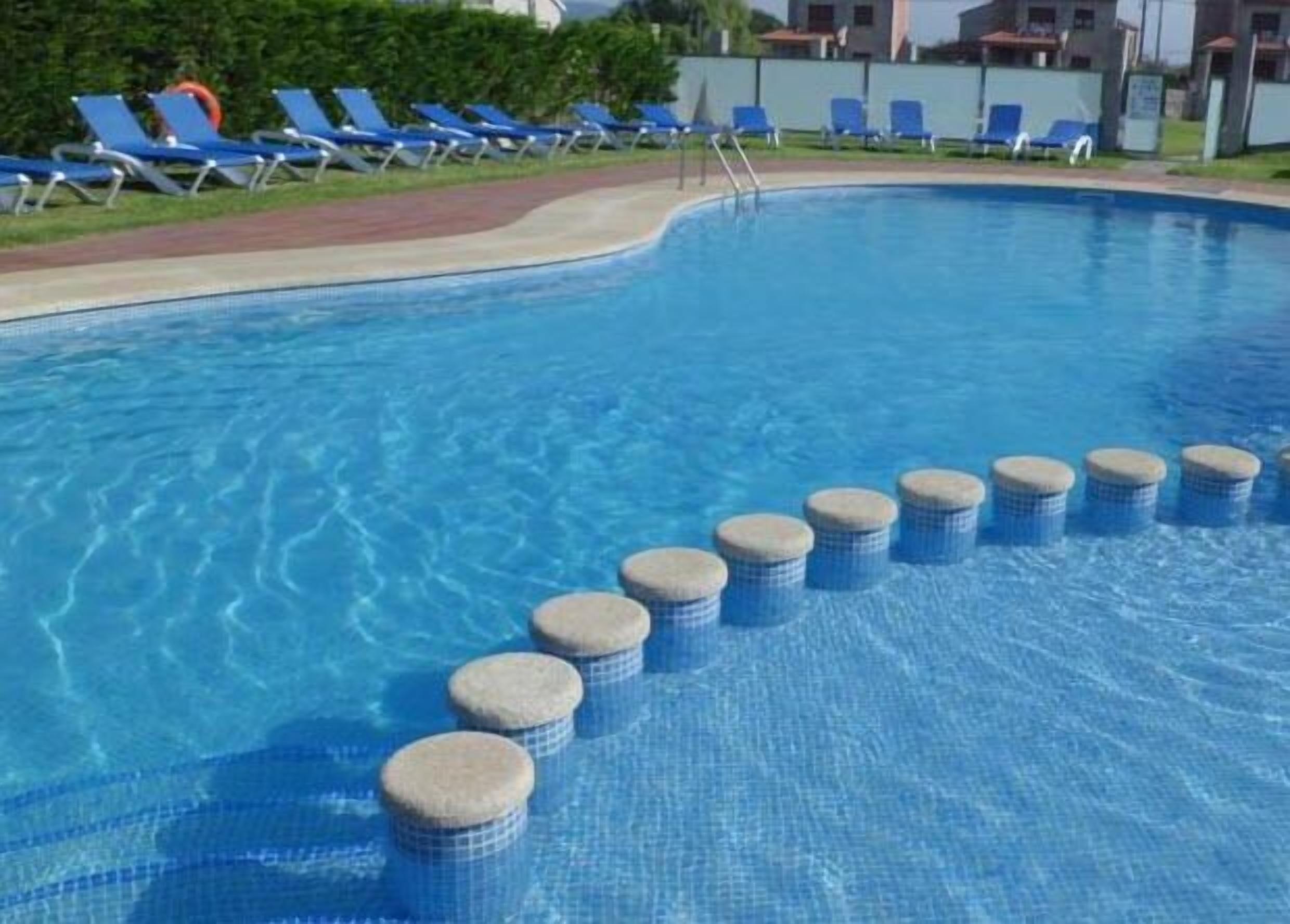 outdoor pool, pool loungers