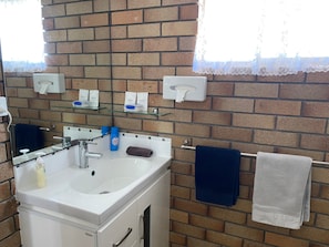 Shower, hair dryer, bathrobes, towels