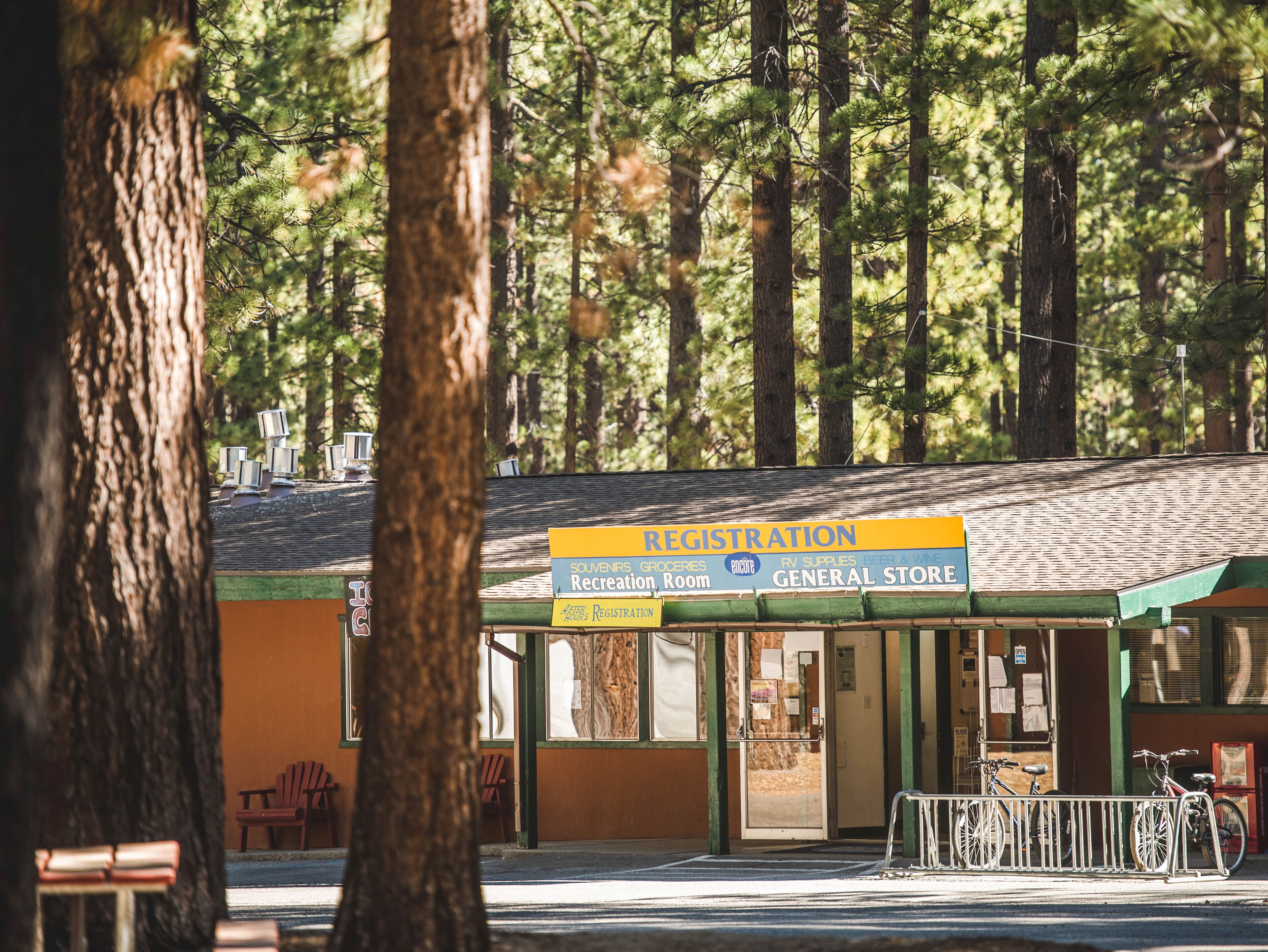 A building with a registration sign, a general store, and a recreation room.