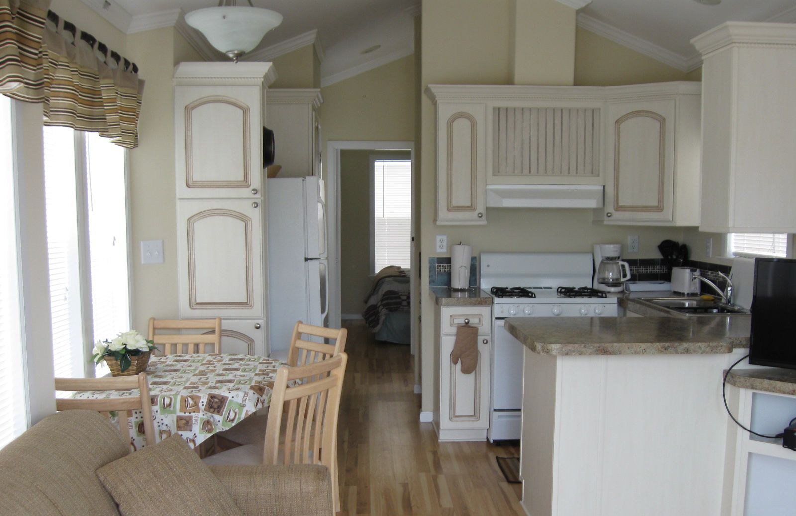 Fridge, microwave, coffee/tea maker, cookware/dishes/utensils