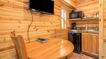 Deluxe Cabin (No Pets, Linens Included) | Private kitchen | Coffee/tea maker, dining tables