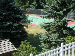 A tennis court surrounded by trees. - Chehalis RV & Camping Resort (Chehalis)