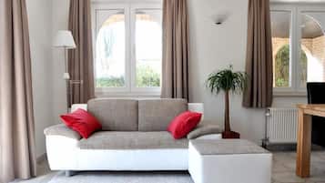 Apartment, 1 Bedroom | Living area | Flat-screen TV, iPod dock