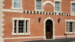 A brick building with the sign 'ABERGAVENNY HOTEL' above the entrance. - The Abergavenny Hotel  (Abergavenny)